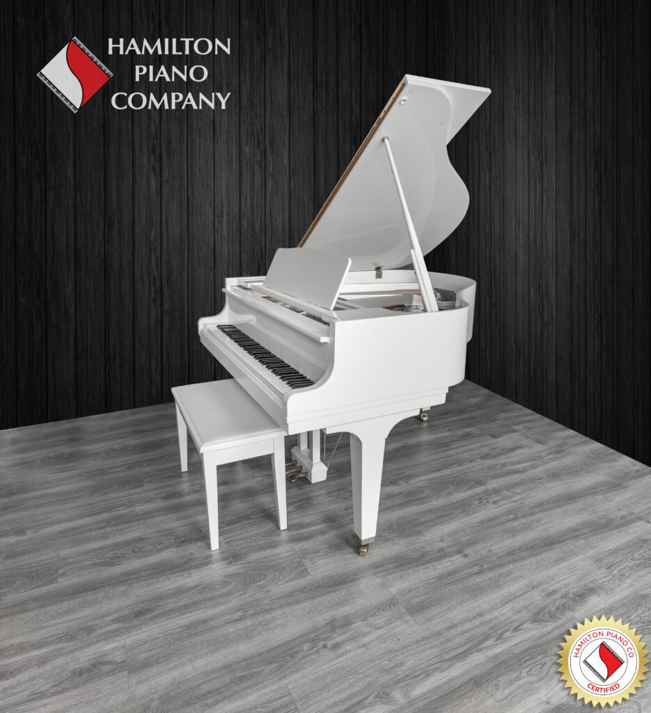 White Kawai baby grand piano