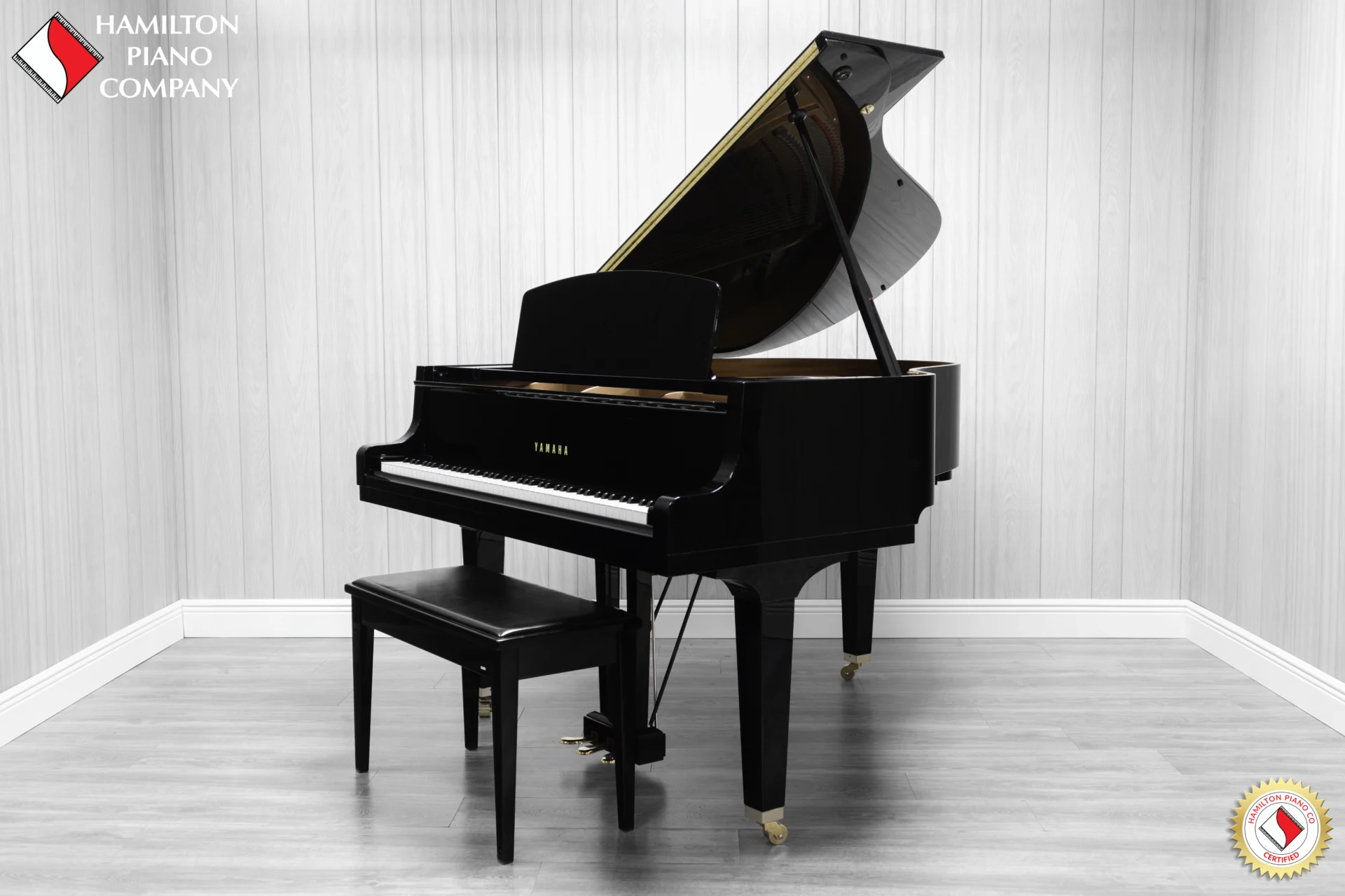 A Yamaha GH1 Baby Grand Piano in a high polish ebony finish.