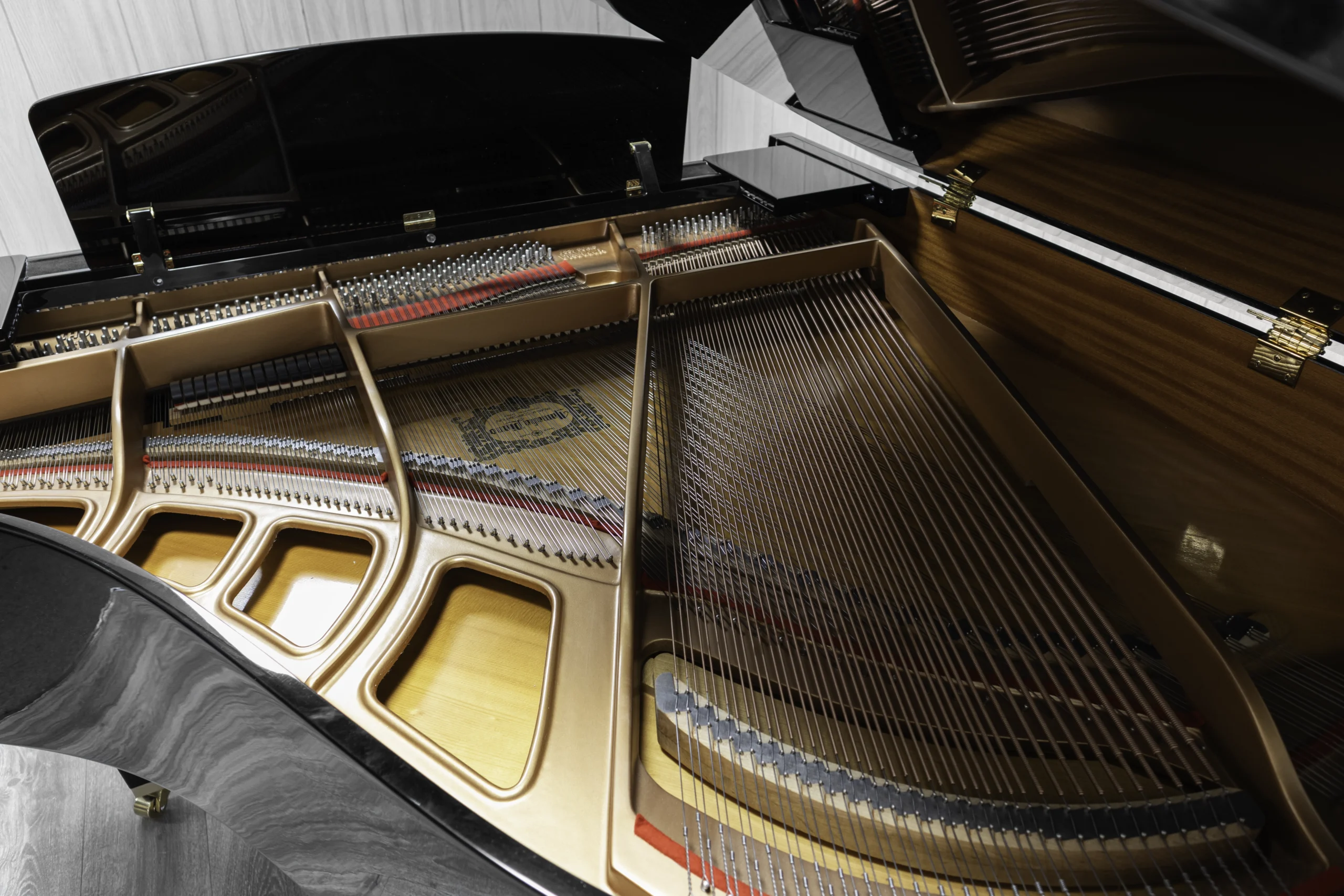 A Yamaha GH1 Baby Grand Piano in a high polish ebony finish.