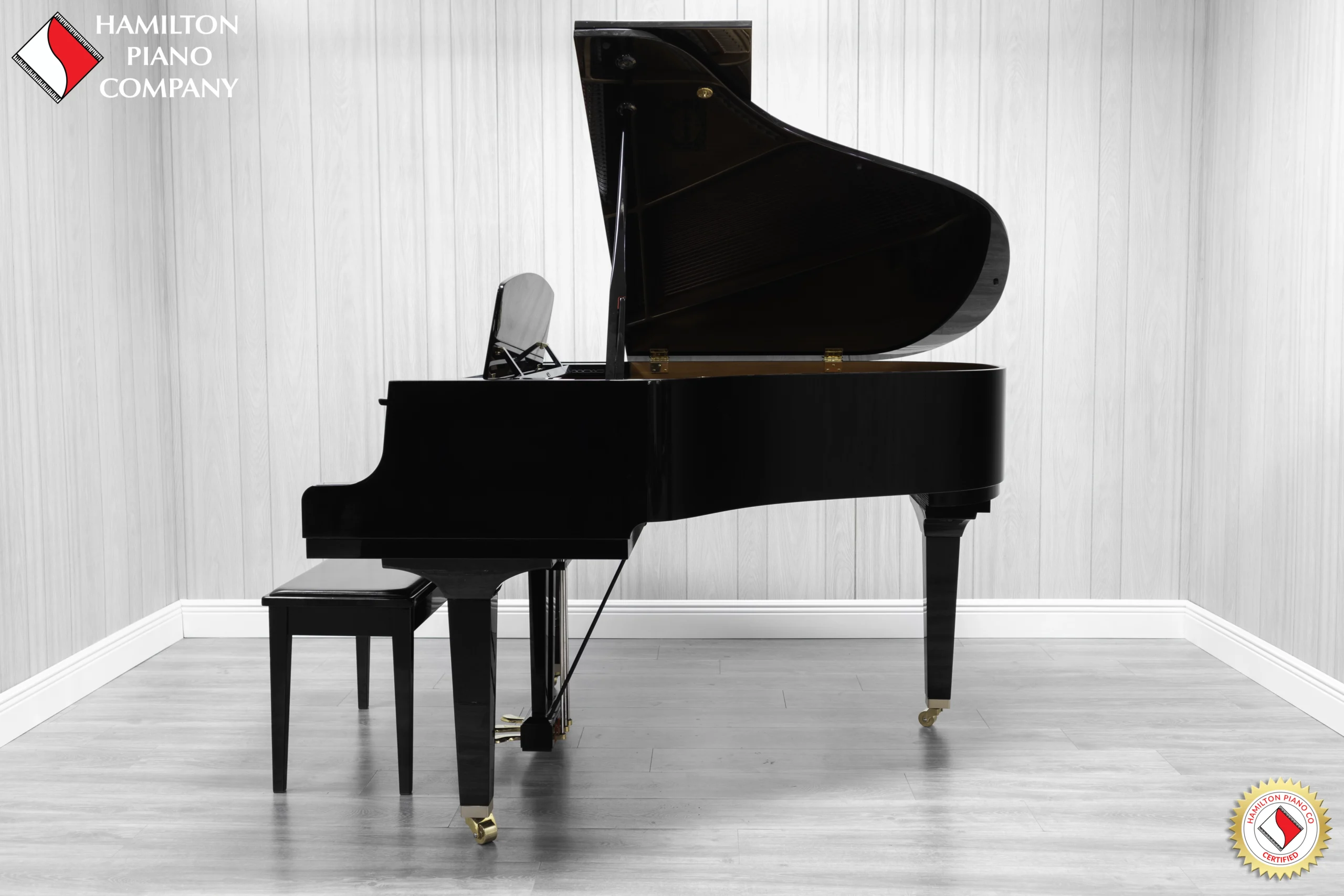 A Yamaha GH1 Baby Grand Piano in a high polish ebony finish.