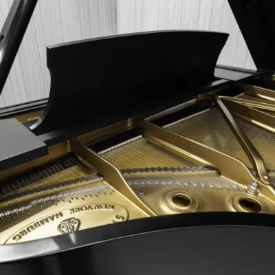 1984 Steinway B Grand Piano in satin ebony finish. This image shows the interior of the piano including the harp and strings.