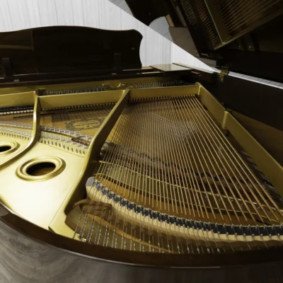 A Yamaha G1 piano in a beautiful mahogany finish with brass hardware. This image shows off the interior of the piano including the harp and strings.