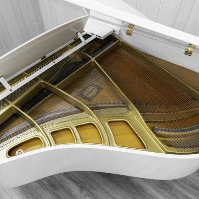 A Yamaha GH1 baby grand piano in a high polish white finish