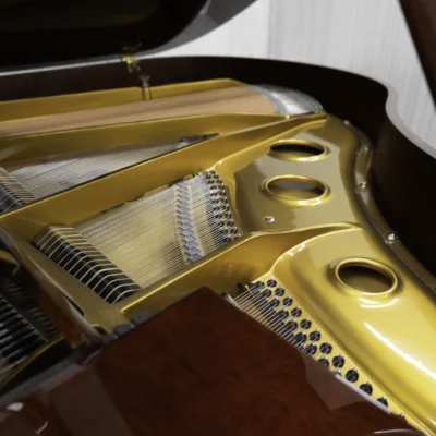 Haileer baby grand piano in high polish mahogany.