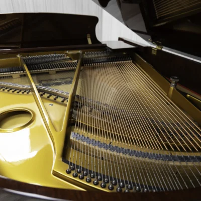 Haileer baby grand piano in high polish mahogany.