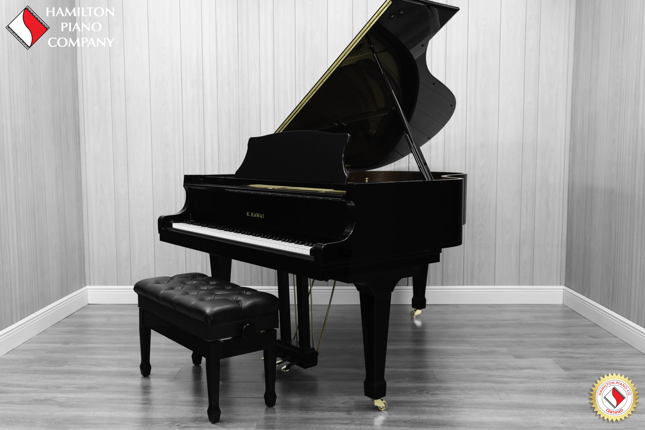 A Kawai RX-3 grand piano in a high-polish ebony finish.