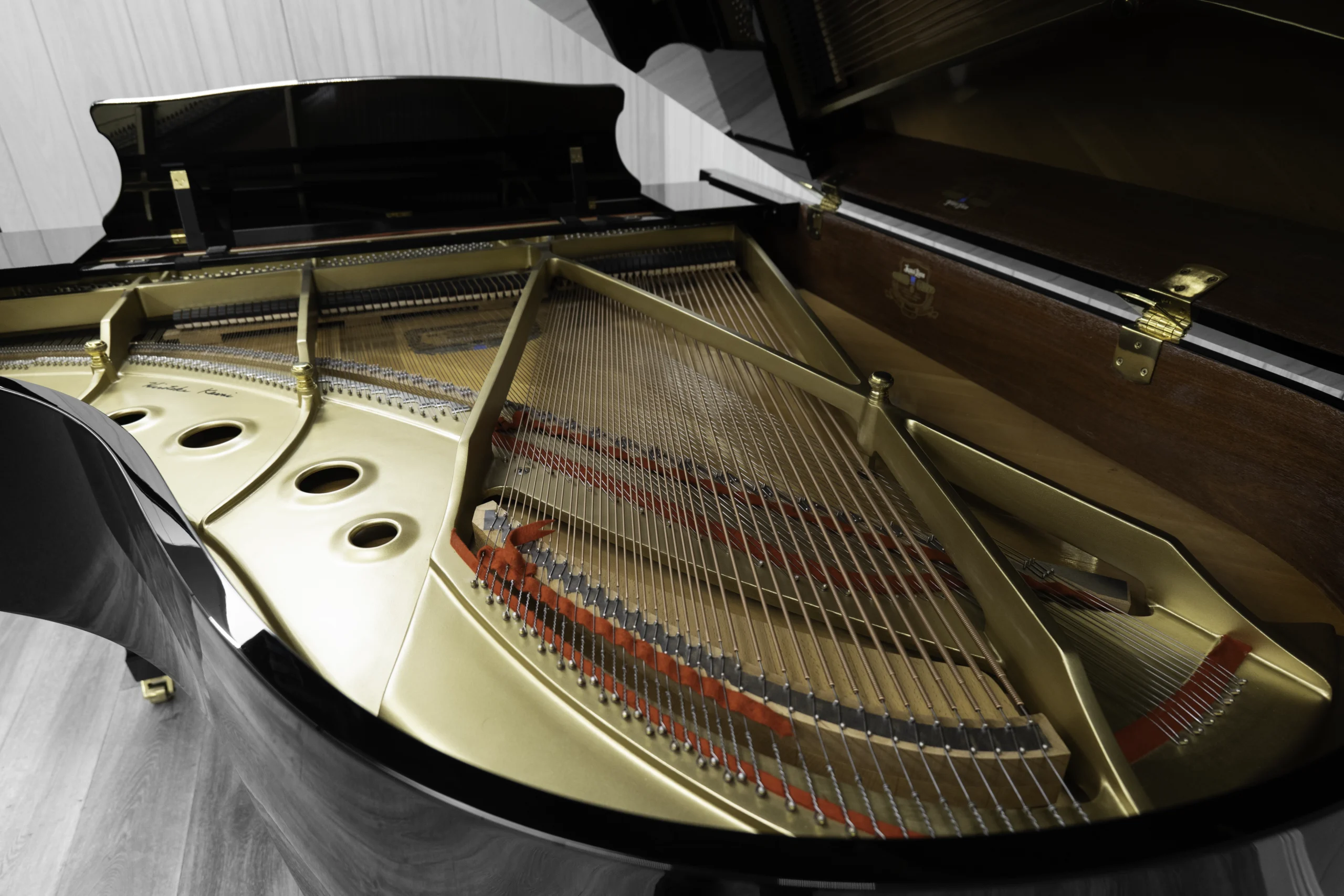A Kawai RX-3 grand piano in a high-polish ebony finish.