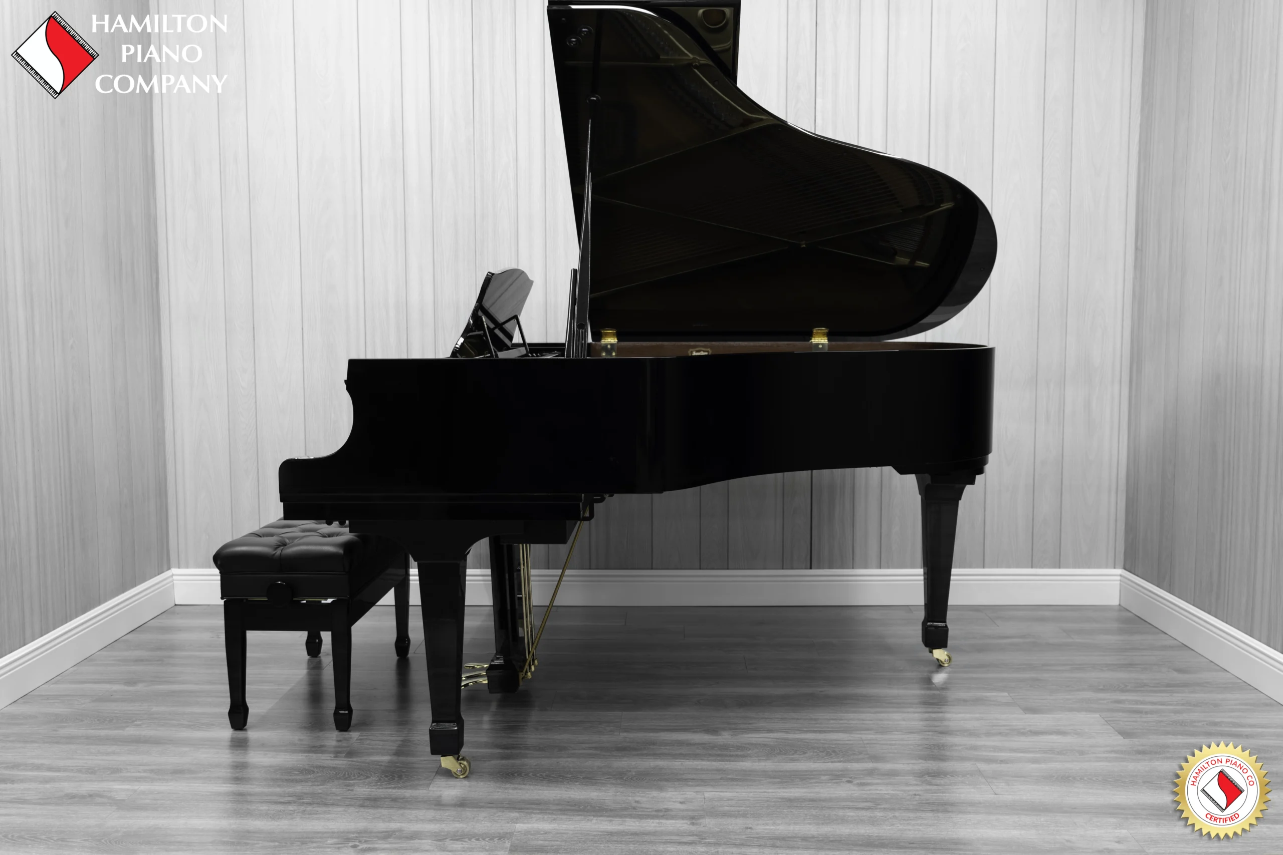A Kawai RX-3 grand piano in a high-polish ebony finish.