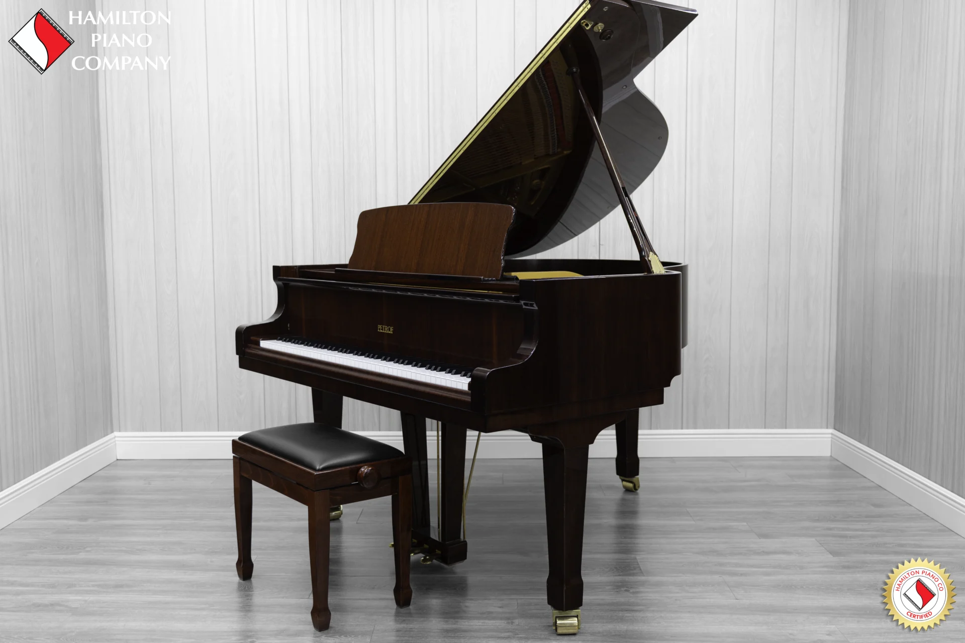 Petrof baby grand piano in high polish mahogany finish