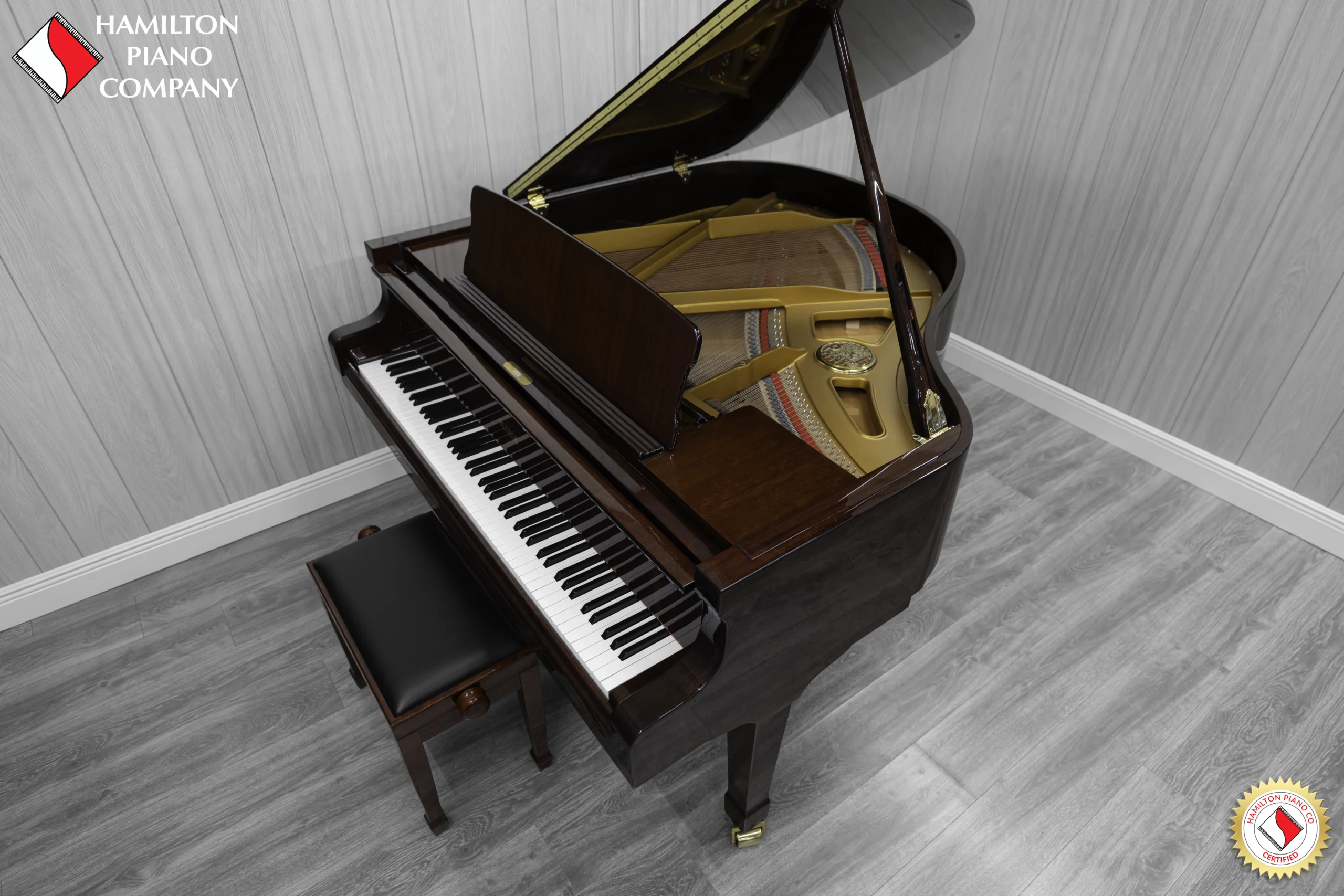 Petrof baby grand piano in high polish mahogany finish