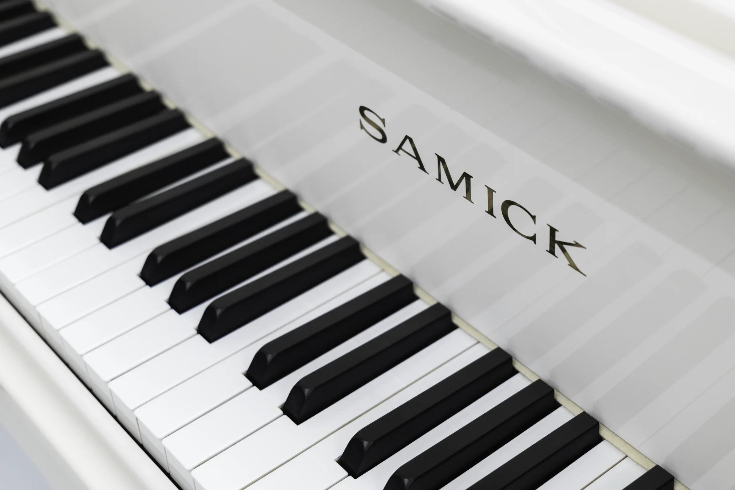 Samick SG-161 Baby Grand Piano in high-polish white finish
