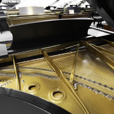 A 9ft Steinway D Concert Grand Piano in hand-rubbed satin ebony finish. An internal shot focusing on the piano harp and strings.
